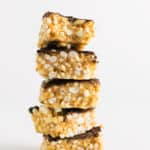 Low Sugar Scotcheroos | Raising Sugar Free Kids - these peanut butter puffed rice bars are sweet, fudgy and delicious. They are also low in sugar, fructose free, gluten free and vegan. They are simple to make, and contain only 1 tsp sugar per serve rather than the usual 7! #lowsugar #glutenfree #vegan #halloween