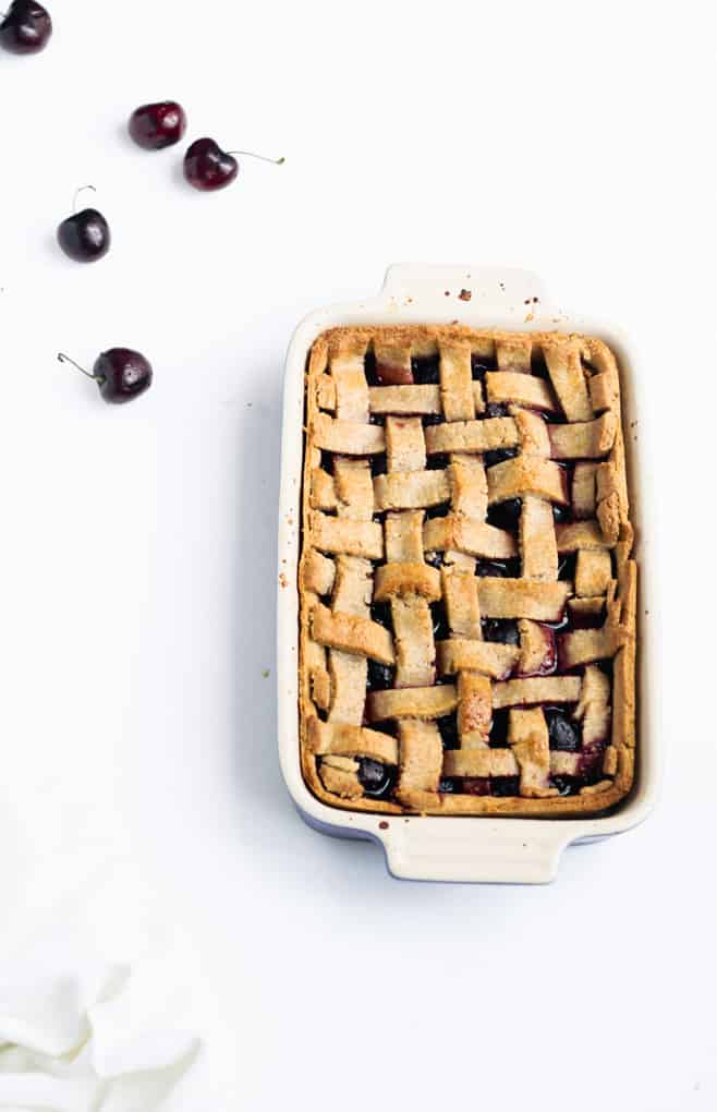 This Delightful Low Sugar Cherry Pie Will Make You Smile | Add Some Veg - this low sugar cherry pie slices into beautiful bars and tastes amazing! Bonus: it has less than 1 tsp sugar per serve, is made with just 8 ingredients, including the 1-minute wholegrain pastry, and is packed with melatonin-inducing cherries for a good night’s sleep! #cherrypie #lowsugar #sugarfree #easybaking #kidfriendly #addsomeveg 