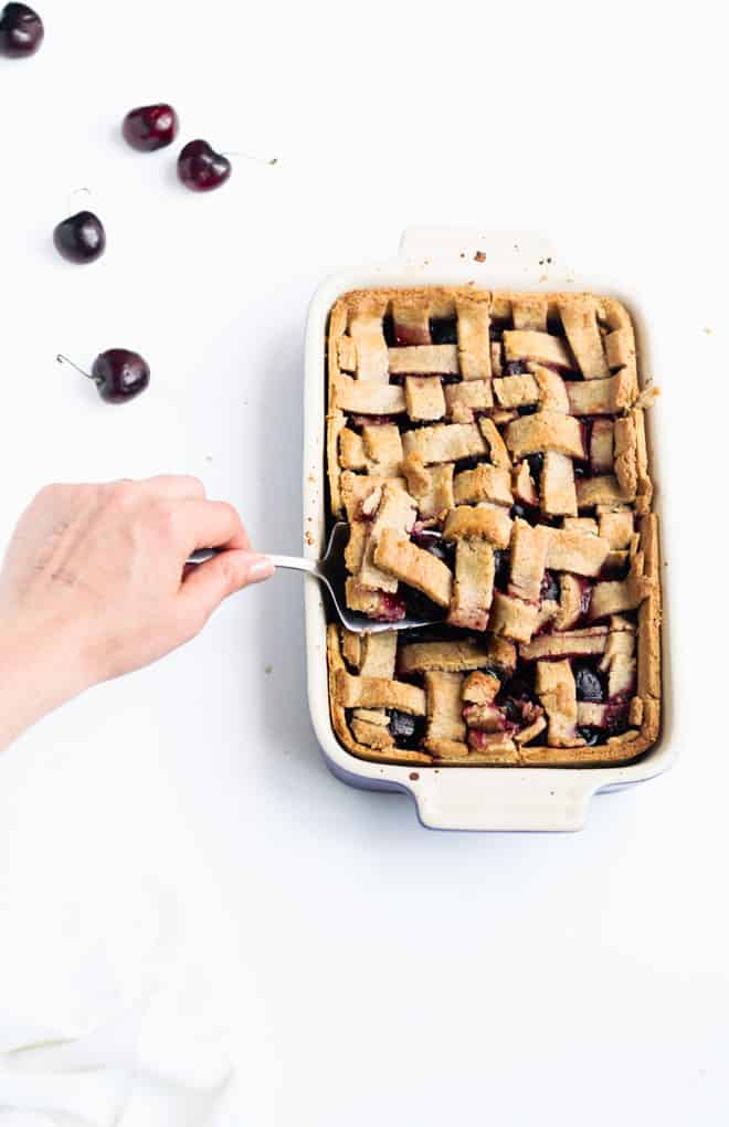 This Delightful Low Sugar Cherry Pie Will Make You Smile | Add Some Veg - this low sugar cherry pie slices into beautiful bars and tastes amazing! Bonus: it has less than 1 tsp sugar per serve, is made with just 8 ingredients, including the 1-minute wholegrain pastry, and is packed with melatonin-inducing cherries for a good night’s sleep! #cherrypie #lowsugar #sugarfree #easybaking #kidfriendly #addsomeveg